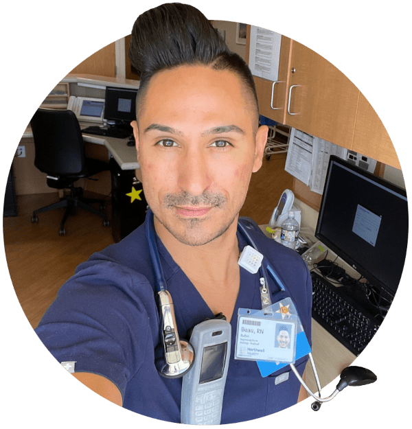 A man in medical scrubs taking a selfie